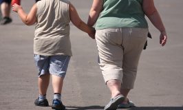 An overweight child and mother.